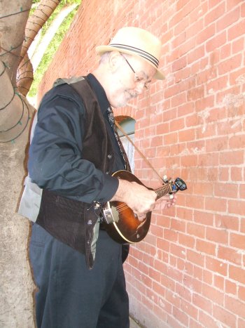 Jim tuning the mandolin